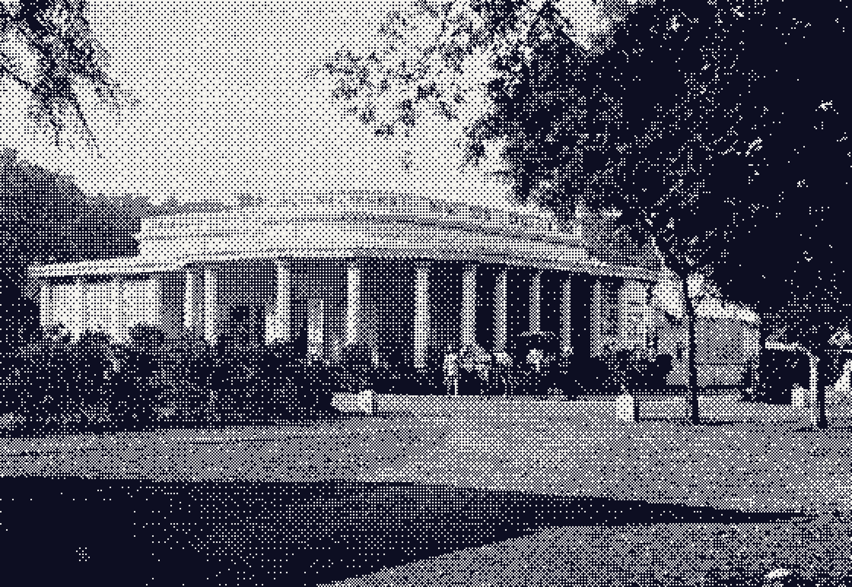 The columned studio building of Raja Deen Dayal and Sons, with a horse carriage waiting outside.